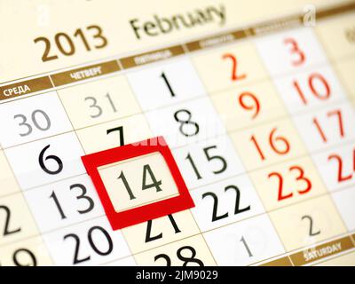 Calendar page with red frame on February 14 2013 Stock Photo