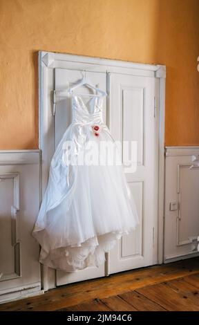Wedding dress on hanger Stock Photo