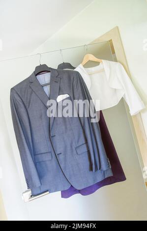 Clothes hanging on the door Stock Photo