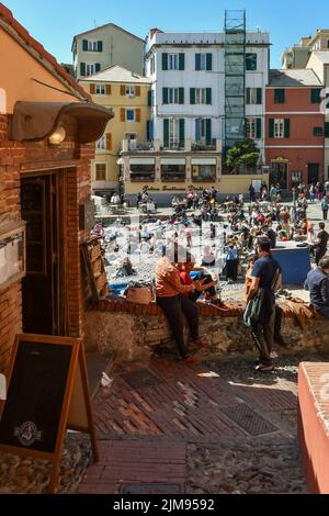 The old fishing village with the small beach a short distance from Genoa center crowded with tourists on Easter Monday, Boccadasse, Liguria, Italy Stock Photo