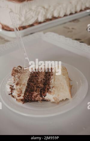 close up slice of birthday cake on plate Stock Photo