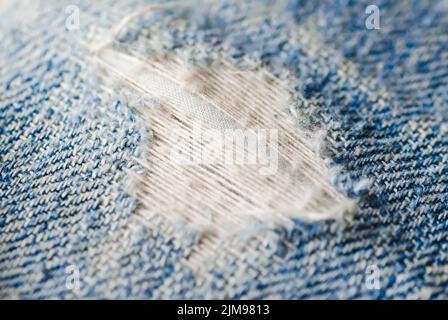 Blue torn denim jeans texture Stock Photo