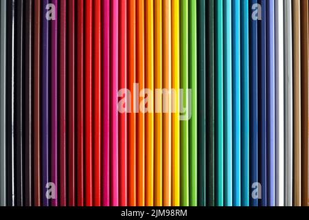 Colored pencils palette. School supplies for kids. Colorful wooden pencils lined up. Stock Photo