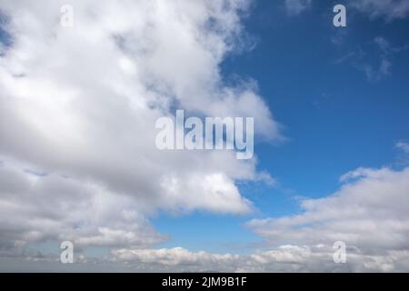 White clouds on a clear blue sky Stock Photo
