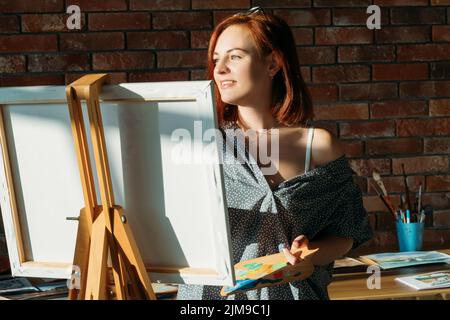fine artist work studio inspiration female canvas Stock Photo
