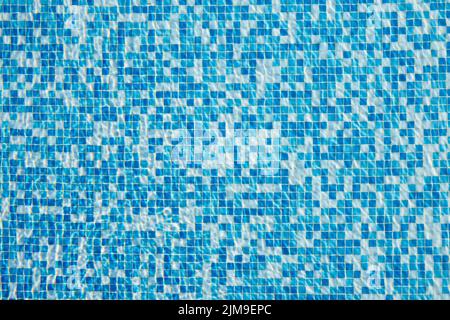 Abstract background of sparkling cool blue water in a mosaic swimming pool Stock Photo