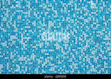 Abstract background of sparkling cool blue water in a mosaic swimming pool Stock Photo