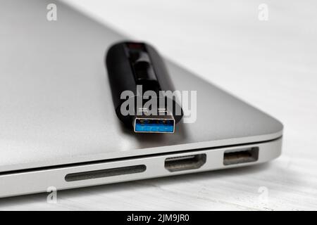 Thumb drive with fast USB speed technologies on top of computer Stock Photo