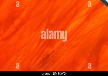Glass pane as background in different shades of red. Stock Photo