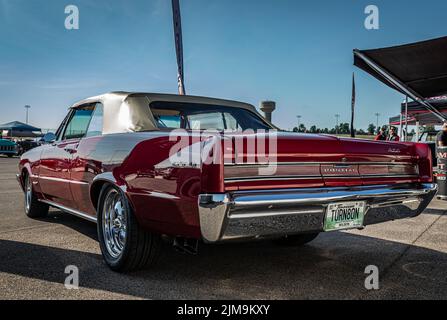 Lebanon, TN - May 13, 2022: Wide angle low perspective back corner view of a 1964 Pontiac GTO Convertible at a local car show. Stock Photo