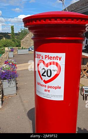 20s plenty, Where People Are, slow down, sign, on postbox, Eastcombe village, Stroud, Gloucestershire, England, UK, GL6 7EB Stock Photo
