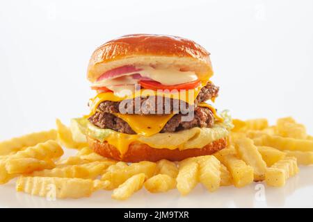 Brioche donut double decker beef cheese burger with ranch tomato and lettuce. Stock Photo