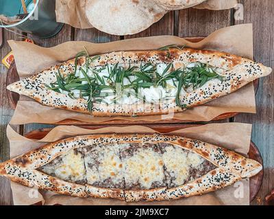 Fancy Lebanese Middle Eastern breakfast, Freshly baked Flatbread of cheese, appetizers - Arabian food manouche - Levantine cuisine Stock Photo