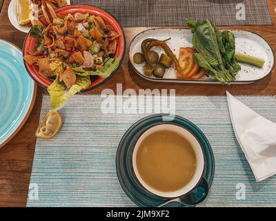 Fancy Lebanese Middle Eastern breakfast, Freshly baked Flatbread of cheese, appetizers - Arabian food manouche - Levantine cuisine Stock Photo