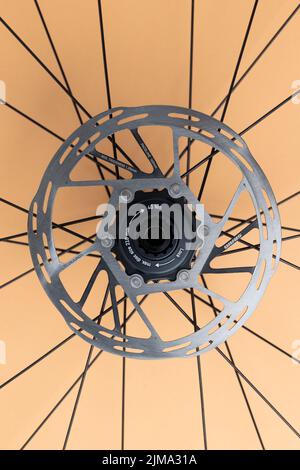 The SRAM Disc Brake with DT Swiss wheel isolated on orange background Stock Photo