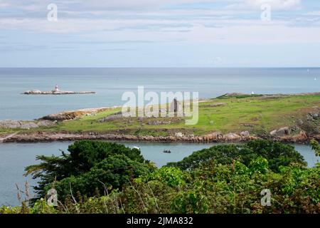 The Dalkey Island seen from the Sorrento Park in County Dublin, Republic of Ireland. The Irish Sea on the horizon. Sunny summer day. Stock Photo