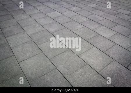 Old concrete tiles in the walkway. Abstract architecture background Stock Photo