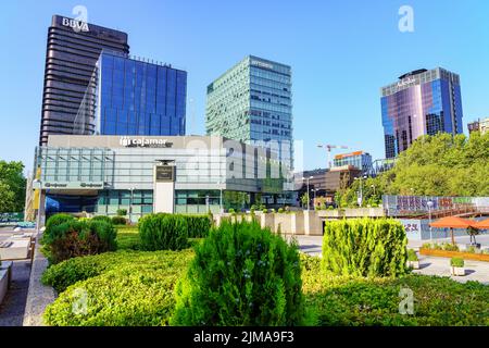 Madrid, Spain - July 30, 2022: Madrid's financial district with tall company headquarters and office buildings in the city center. Stock Photo