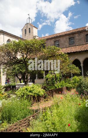 New York City, New York - June 29, 2019:  View of the Met Cloisters in Washington Height Manhattan with architectural details and people visiting in s Stock Photo