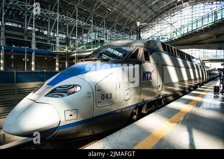High-speed bullet trains (KTX) and Korail trains stop at the Seoul station in South Korea. Stock Photo