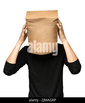 Young man covering his head using a paper bag. Man thinking Stock Photo