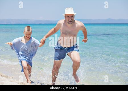 Father Son Running Seashore Stock Photo