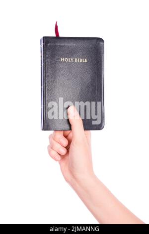 Woman hand holding the Holy Bible on white Stock Photo