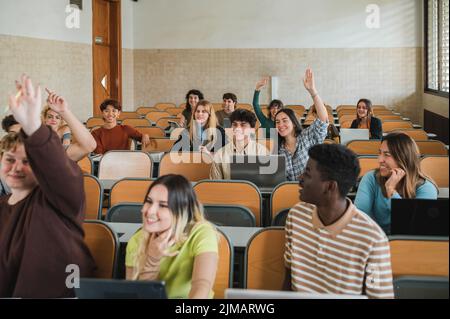 Students wishing to answer question Stock Photo