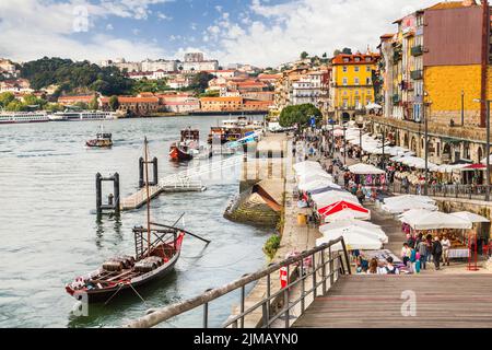 The Douro River with colorful houses and boats of wine in Porto, Portugal. Stock Photo