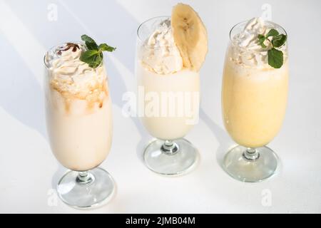 Chocolate milkshake. Covered with whipped cream in plastic glass isolated  on whi #Sponsored , #AD, #AFFILIATE, #C…