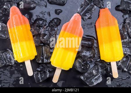 Fruit popsicles ice cream on black Stock Photo