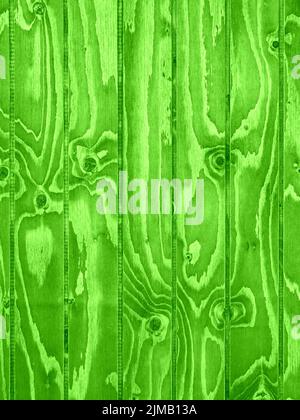 Vertically aligned green wooden boards with intense grain as background Stock Photo