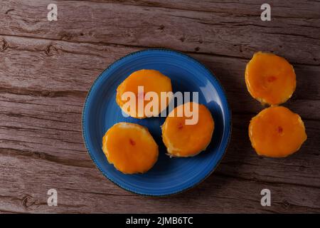 tortas locas, crazy cake typical from andalucia spain on a blue plate on a wooden background Stock Photo