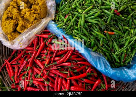 Yellow curry paste and chilies Stock Photo