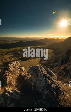 Paragliding over mountains in lower austria during sunset Stock Photo