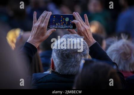A person recording a concert with smartphone Stock Photo