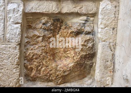 A closeup shot of the handprint of Jesus n the stone in Jerusalem Stock Photo