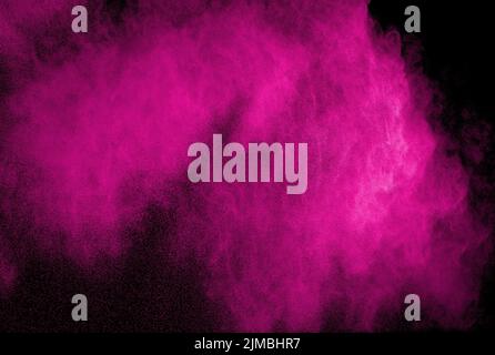 Pink powder explosion on black background.Pink heart shape dust splash cloud in the air. Stock Photo