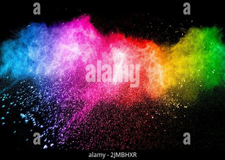Multicolored powder explosion on black  background. Color dust splash cloud on background Stock Photo