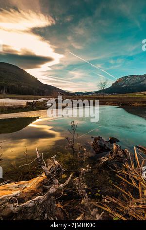 Colorful sunset over a Lake in lower austria in winter Stock Photo