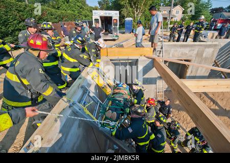 At 4:58 p.m. on Tuesday, August 20th, 2013, the East Hampton Fire Department 'White Knights' Heavy Rescue Squad was called assist members of the East Stock Photo