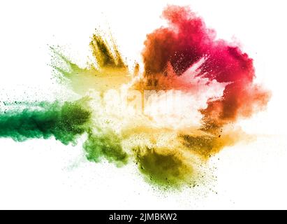Abstract multi color powder explosion on white background.  Freeze motion of  dust  particles splash Stock Photo
