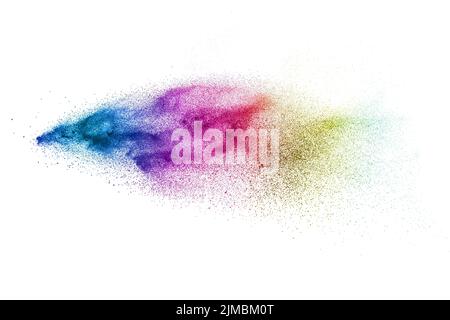 Multicolored particles explosion on white background. Color dust splattered. Stock Photo