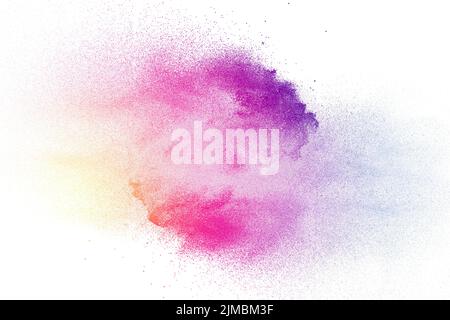 Multi color powder explosion on white background. Purple pink yellow dust splash. Stock Photo
