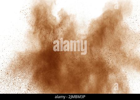 Brown powder explosion on white background. Stock Photo