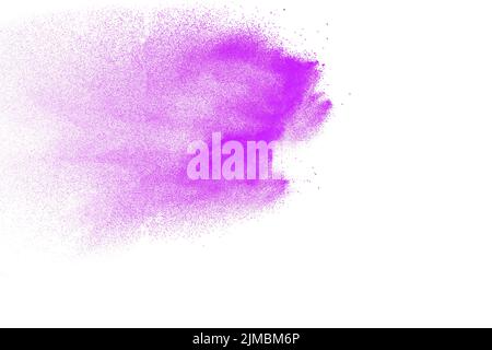 Purple particles explosion on white background. Freeze motion of purple dust splash on background. Stock Photo