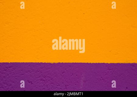Texture painted wall in yellow and purple color Stock Photo