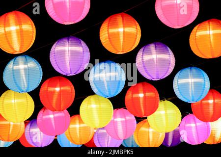 Colorful traditional Chinese Lantern lamp in dark background.Background of multicolored lanterns. Stock Photo
