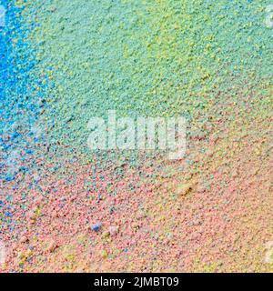 Colorful background of chalk powder. Multicolored dust particles splattered on black background. Stock Photo