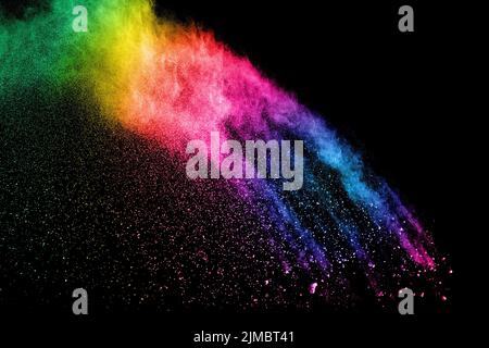 Abstract colorful powder explosion on black background.Freeze motion of dust splash.Painted Holi. Stock Photo